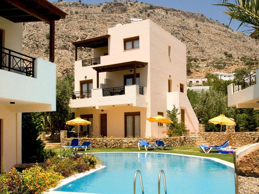 Stone clad holiday villa with pool and grassed sunbathing area. Click here to visit the villa page